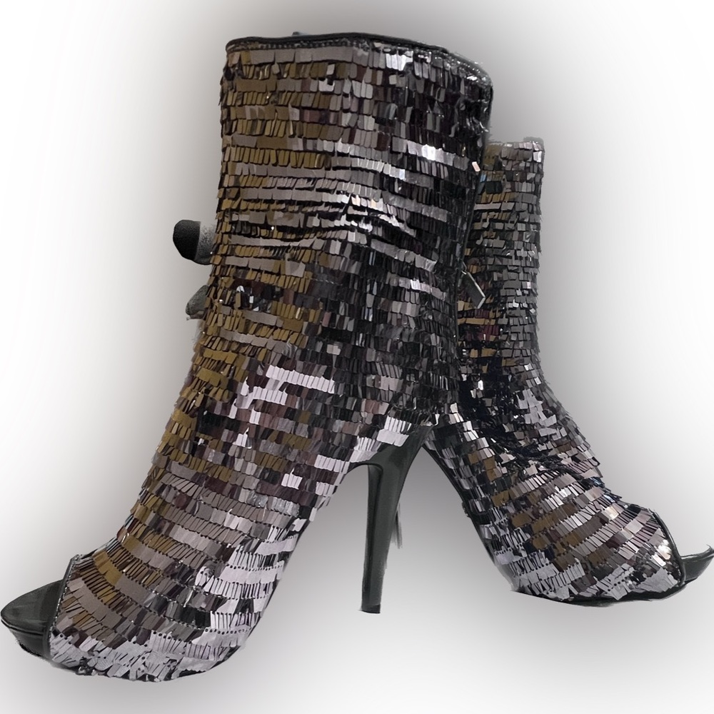 New, never worn, in box. Dereon Dynamite pewter stiletto peep toe bootie. Sz. 9